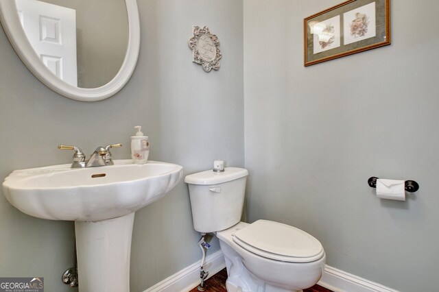 315 Antebellum Way, Fayetteville, GA 30215 - half bathroom with baseboards, toilet, and a sink