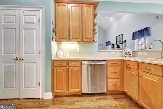 315 Antebellum Way, Fayetteville, GA 30215 - kitchen featuring stainless steel dishwasher, vaulted ceiling, a sink, light wood-type flooring, and light countertops