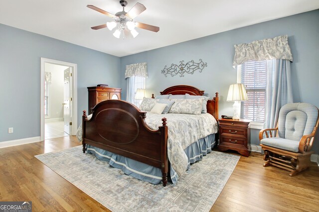 315 Antebellum Way, Fayetteville, GA 30215 - bedroom featuring multiple windows, wood finished floors, baseboards, and a ceiling fan