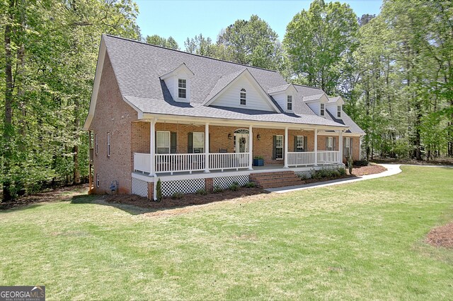 315 Antebellum Way, Fayetteville, GA 30215 - view of front of home featuring brick siding, covered porch, a front yard, and a shingled roof