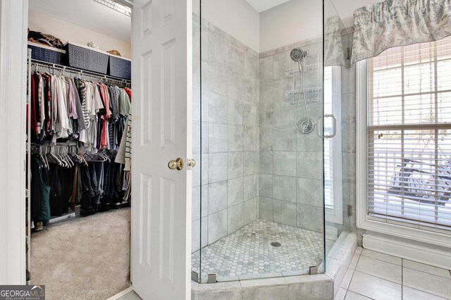 315 Antebellum Way, Fayetteville, GA 30215 - bathroom featuring a stall shower, plenty of natural light, and a spacious closet