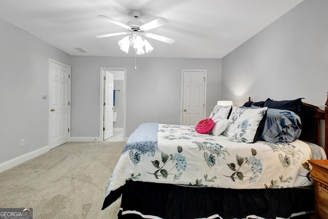 315 Antebellum Way, Fayetteville, GA 30215 - carpeted bedroom with baseboards, ensuite bathroom, and ceiling fan