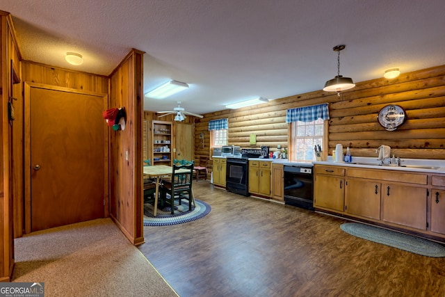 kitchen featuring black appliances, log walls, a sink, light countertops, and dark wood finished floors