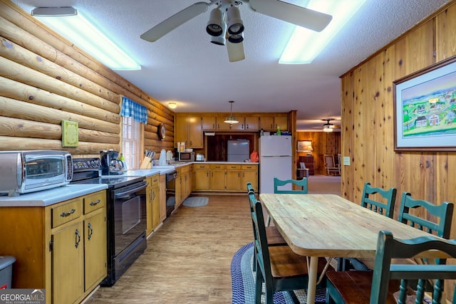kitchen with black appliances, log walls, ceiling fan, light countertops, and a textured ceiling