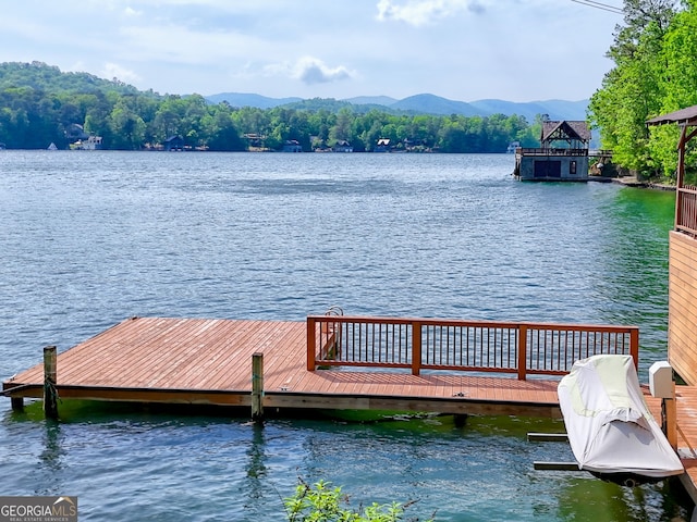 dock featuring a water and mountain view