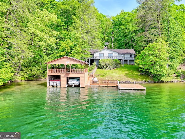 dock with a water view and a forest view