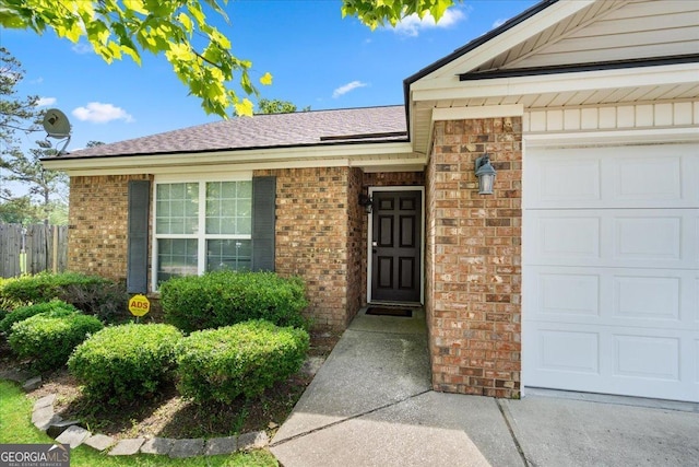 162 W Tahoe Dr, Savannah, GA 31405 - entrance to property with brick siding, a garage, and roof with shingles