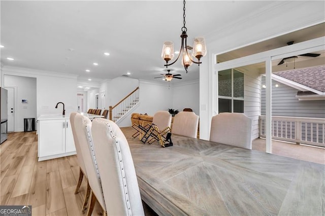178 Sunshower Rdg, Canton, GA 30114 - dining space featuring a ceiling fan, crown molding, a chandelier, recessed lighting, and light wood-style floors