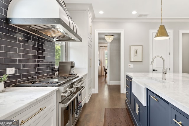 6815 Berkley Rd, Cumming, GA 30040 - kitchen featuring ventilation hood, blue cabinets, double oven range, a sink, and white cabinetry