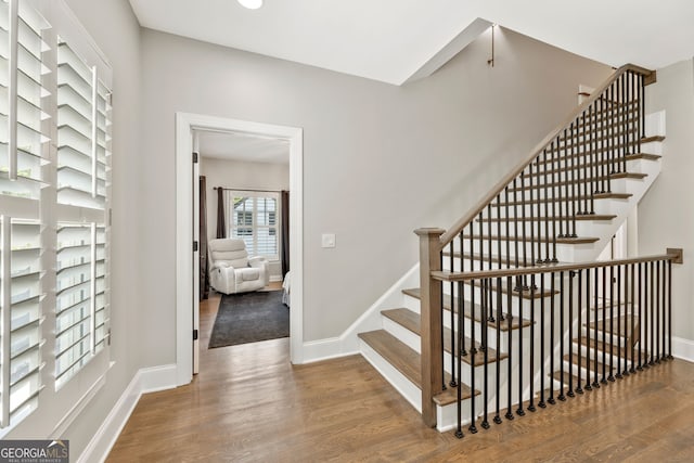6815 Berkley Rd, Cumming, GA 30040 - staircase with wood finished floors and baseboards