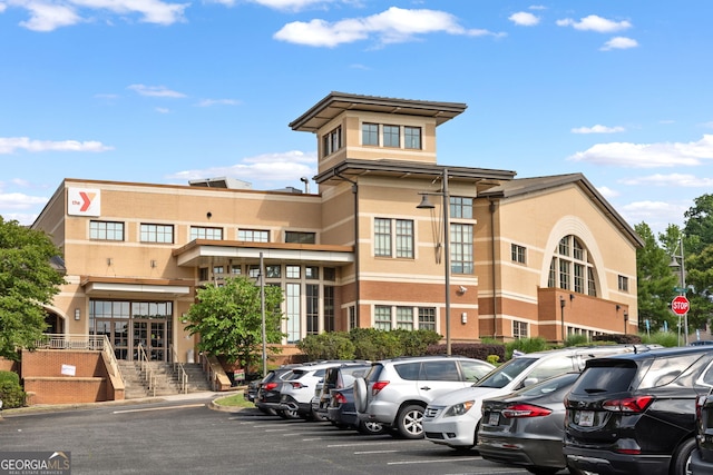 6815 Berkley Rd, Cumming, GA 30040 - view of building exterior featuring uncovered parking