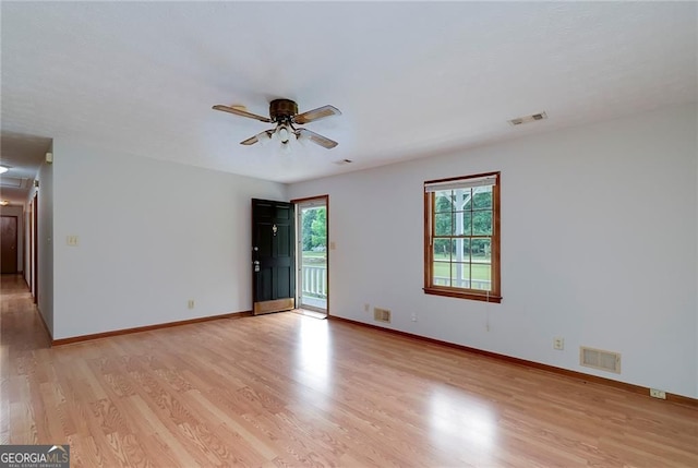 1810 King Mill Rd, Mcdonough, GA 30252 - unfurnished room with light wood-style floors, a ceiling fan, and baseboards