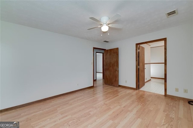 1810 King Mill Rd, Mcdonough, GA 30252 - unfurnished room with light wood finished floors, ceiling fan, and baseboards