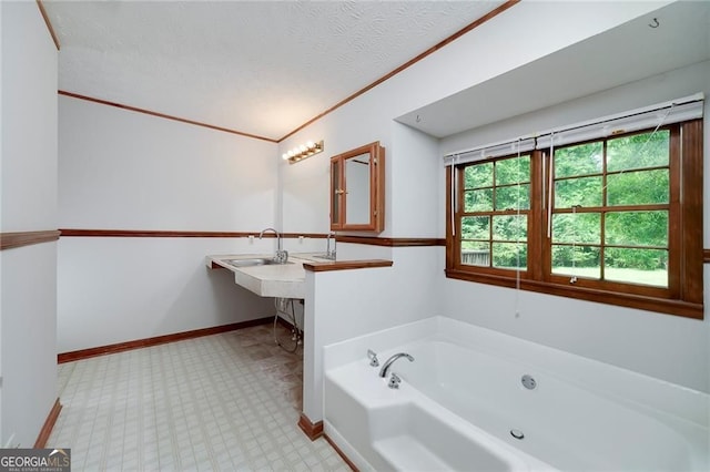 1810 King Mill Rd, Mcdonough, GA 30252 - bathroom with a bath, baseboards, a textured ceiling, and crown molding