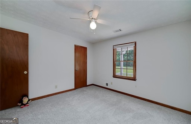 1810 King Mill Rd, Mcdonough, GA 30252 - empty room featuring carpet, baseboards, and ceiling fan