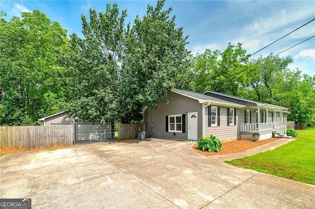 1810 King Mill Rd, Mcdonough, GA 30252 - single story home featuring a porch, an outbuilding, and concrete driveway
