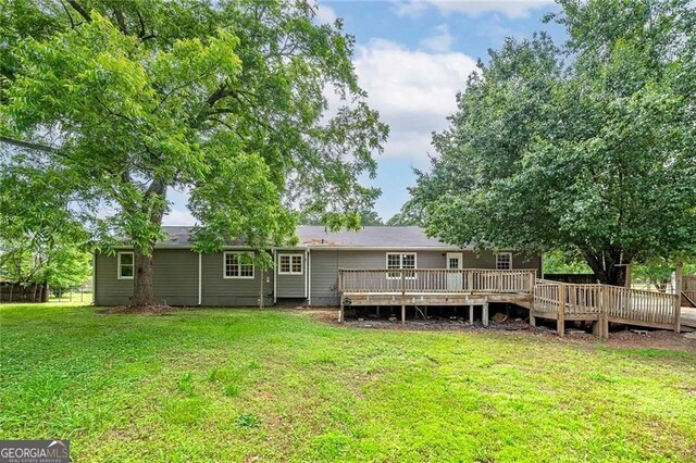 1810 King Mill Rd, Mcdonough, GA 30252 - rear view of property featuring a yard and a wooden deck