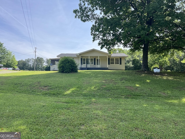 ranch-style home with a front yard