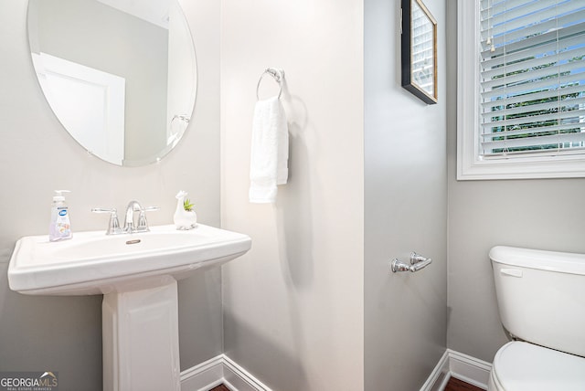 1946 Jeffery Rd NW, Atlanta, GA 30318 - half bathroom featuring toilet and baseboards