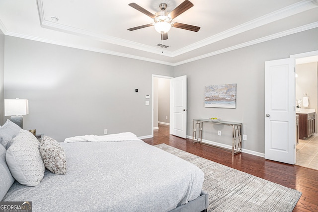 1946 Jeffery Rd NW, Atlanta, GA 30318 - bedroom with wood finished floors, ornamental molding, a tray ceiling, baseboards, and ceiling fan