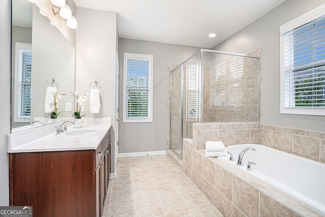 1946 Jeffery Rd NW, Atlanta, GA 30318 - full bath featuring vanity, a garden tub, a stall shower, tile patterned floors, and baseboards