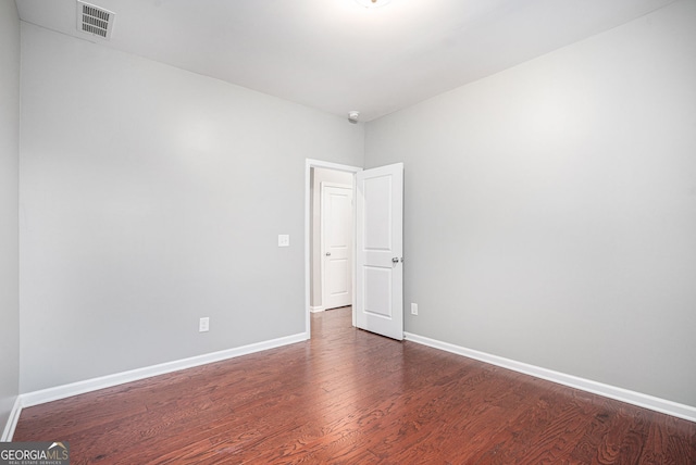 1946 Jeffery Rd NW, Atlanta, GA 30318 - unfurnished room featuring dark wood-style floors, baseboards, and a smoke detector