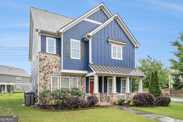 1946 Jeffery Rd NW, Atlanta, GA 30318 - craftsman inspired home with stone siding, a standing seam roof, a porch, cooling unit, and a front lawn
