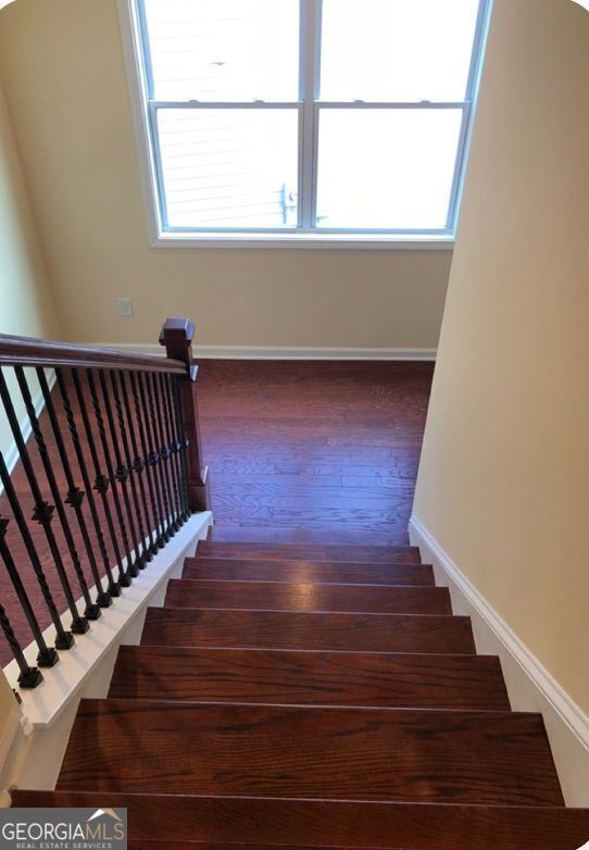 1946 Jeffery Rd NW, Atlanta, GA 30318 - stairway featuring wood finished floors and baseboards