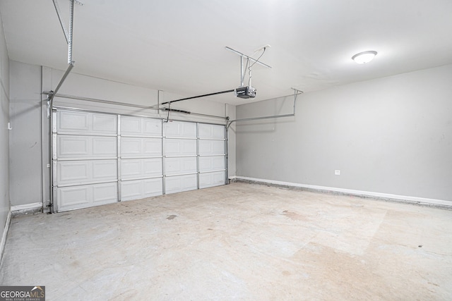 1946 Jeffery Rd NW, Atlanta, GA 30318 - garage featuring a garage door opener and baseboards