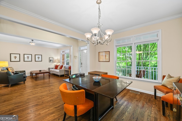 127 Chestnut Ln, Athens, GA 30606 - dining room with crown molding, a chandelier, and dark wood-style flooring