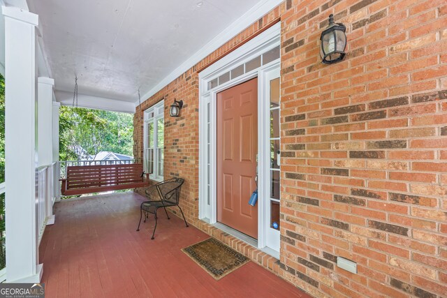 127 Chestnut Ln, Athens, GA 30606 - property entrance with a porch and brick siding
