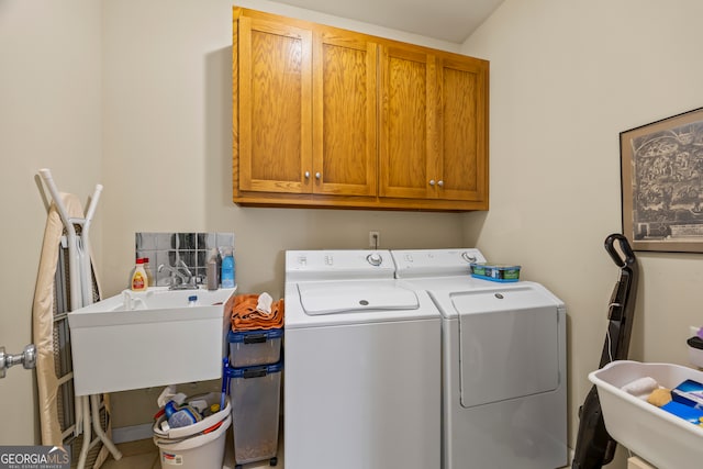 127 Chestnut Ln, Athens, GA 30606 - laundry area featuring washer and clothes dryer and cabinet space