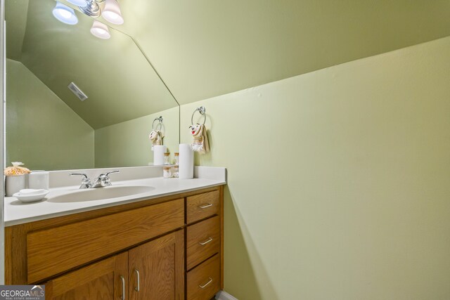 127 Chestnut Ln, Athens, GA 30606 - bathroom with lofted ceiling and vanity