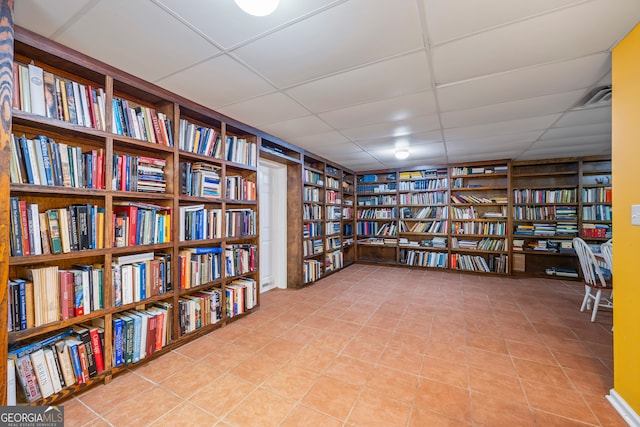 127 Chestnut Ln, Athens, GA 30606 - misc room with bookshelves, a drop ceiling, built in shelves, and tile patterned flooring