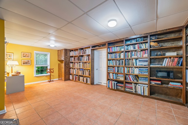 127 Chestnut Ln, Athens, GA 30606 - sitting room with a drop ceiling, tile patterned flooring, built in features, and bookshelves