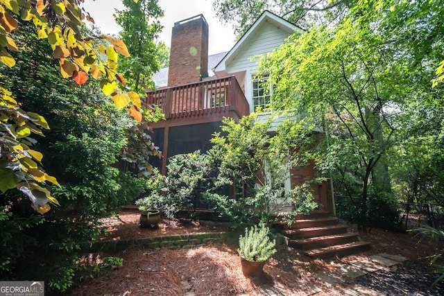 127 Chestnut Ln, Athens, GA 30606 - rear view of property with a chimney and a wooden deck