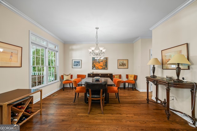 127 Chestnut Ln, Athens, GA 30606 - dining room with dark wood-style floors, ornamental molding, and a chandelier
