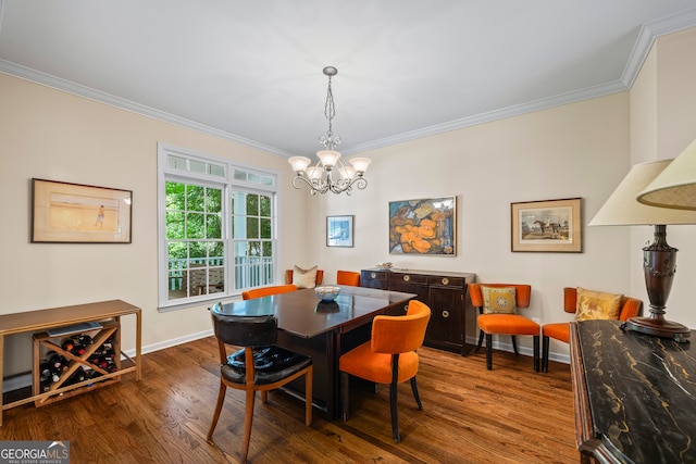 127 Chestnut Ln, Athens, GA 30606 - dining room featuring crown molding, a chandelier, and wood finished floors