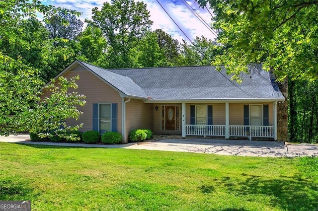 2652 Mount Tabor Church Rd, Dallas, GA 30157 - view of front of property with a porch, a front yard, and roof with shingles