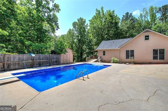 2652 Mount Tabor Church Rd, Dallas, GA 30157 - view of pool featuring a patio area, fence, a storage shed, an outbuilding, and a diving board