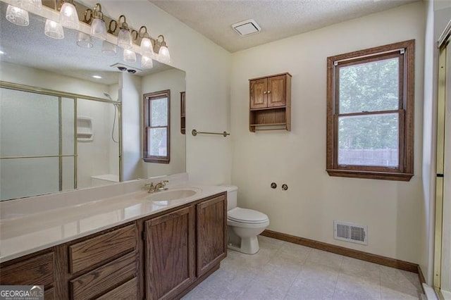 2652 Mount Tabor Church Rd, Dallas, GA 30157 - bathroom featuring baseboards, healthy amount of natural light, toilet, a shower stall, and a textured ceiling