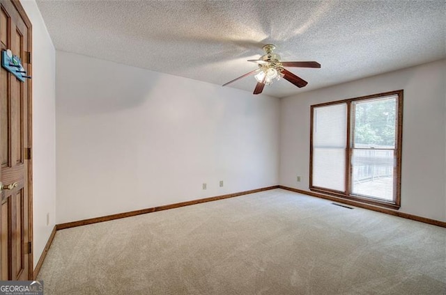 2652 Mount Tabor Church Rd, Dallas, GA 30157 - spare room featuring light carpet, ceiling fan, baseboards, and a textured ceiling