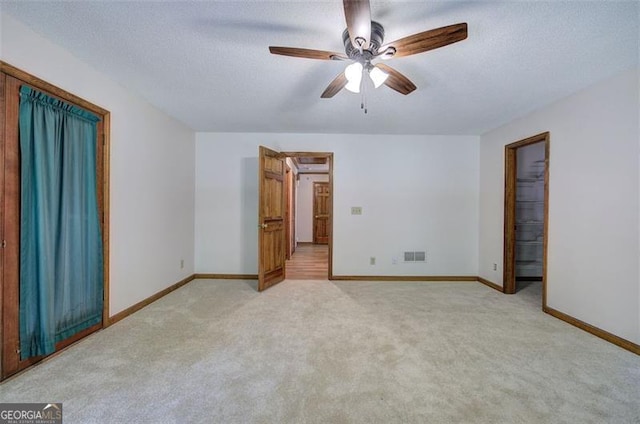 2652 Mount Tabor Church Rd, Dallas, GA 30157 - empty room featuring light colored carpet, baseboards, ceiling fan, and a textured ceiling