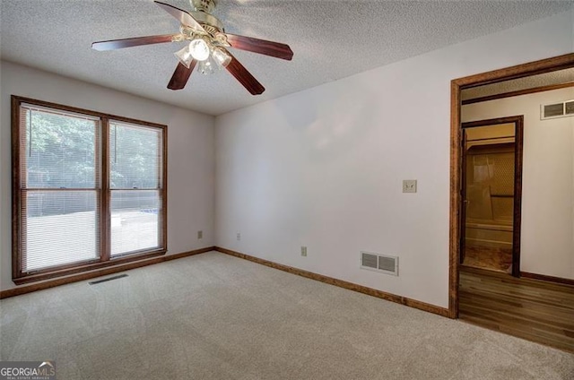 2652 Mount Tabor Church Rd, Dallas, GA 30157 - empty room with light colored carpet, a textured ceiling, baseboards, and a ceiling fan