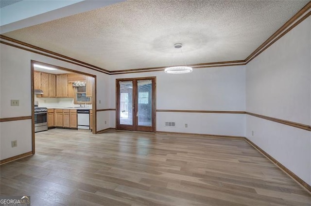 2652 Mount Tabor Church Rd, Dallas, GA 30157 - unfurnished living room featuring crown molding, a textured ceiling, light wood-style flooring, a chandelier, and baseboards