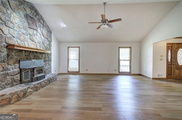 2652 Mount Tabor Church Rd, Dallas, GA 30157 - unfurnished living room featuring high vaulted ceiling, healthy amount of natural light, ceiling fan, wood finished floors, and baseboards