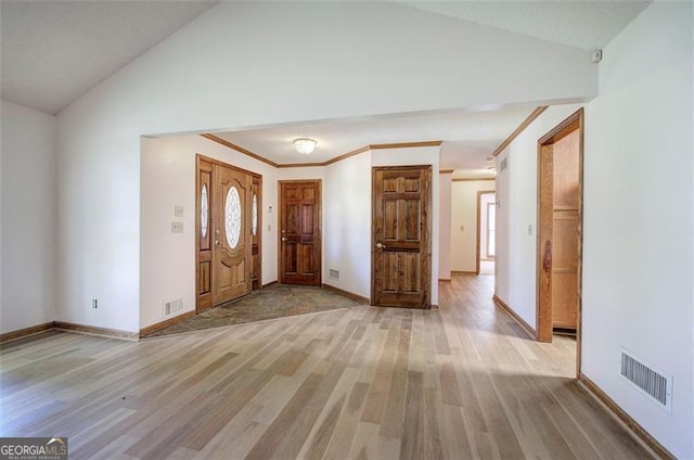 2652 Mount Tabor Church Rd, Dallas, GA 30157 - foyer with vaulted ceiling, wood finished floors, baseboards, and crown molding