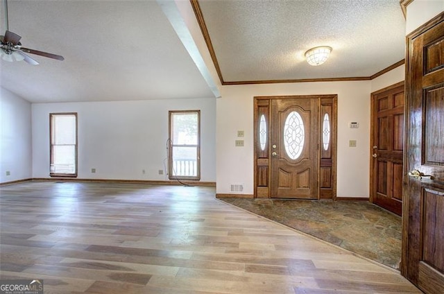 2652 Mount Tabor Church Rd, Dallas, GA 30157 - foyer entrance featuring wood finished floors, a textured ceiling, a ceiling fan, baseboards, and crown molding