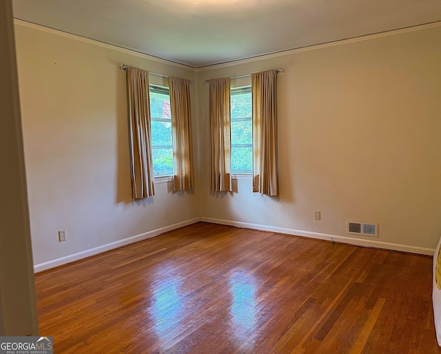 894 Nottingham Dr, Avondale Estates, GA 30002 - empty room with wood finished floors, baseboards, and ornamental molding