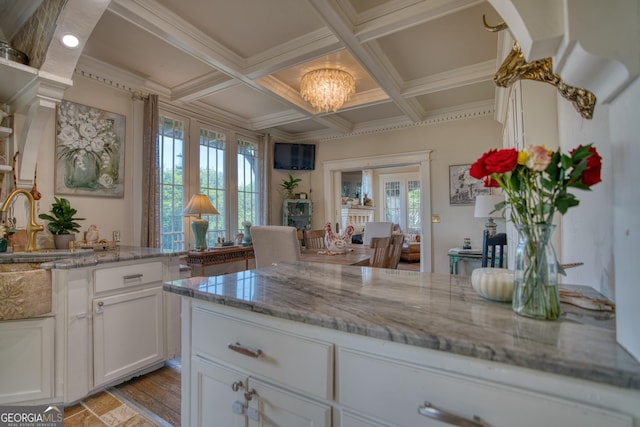 407 E 3rd St, Rome, GA 30161 - kitchen featuring white cabinetry, light stone countertops, beamed ceiling, a chandelier, and coffered ceiling